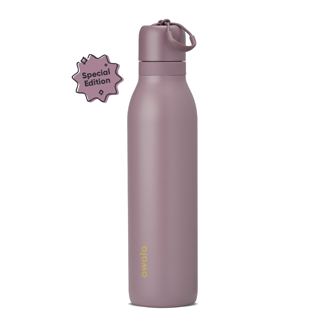 FreeSip Twist 24oz, coral pink body with orange-red lid and purple band; slim insulated bottle